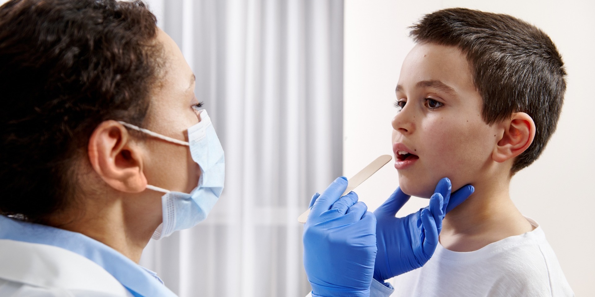 Child getting his throat examined